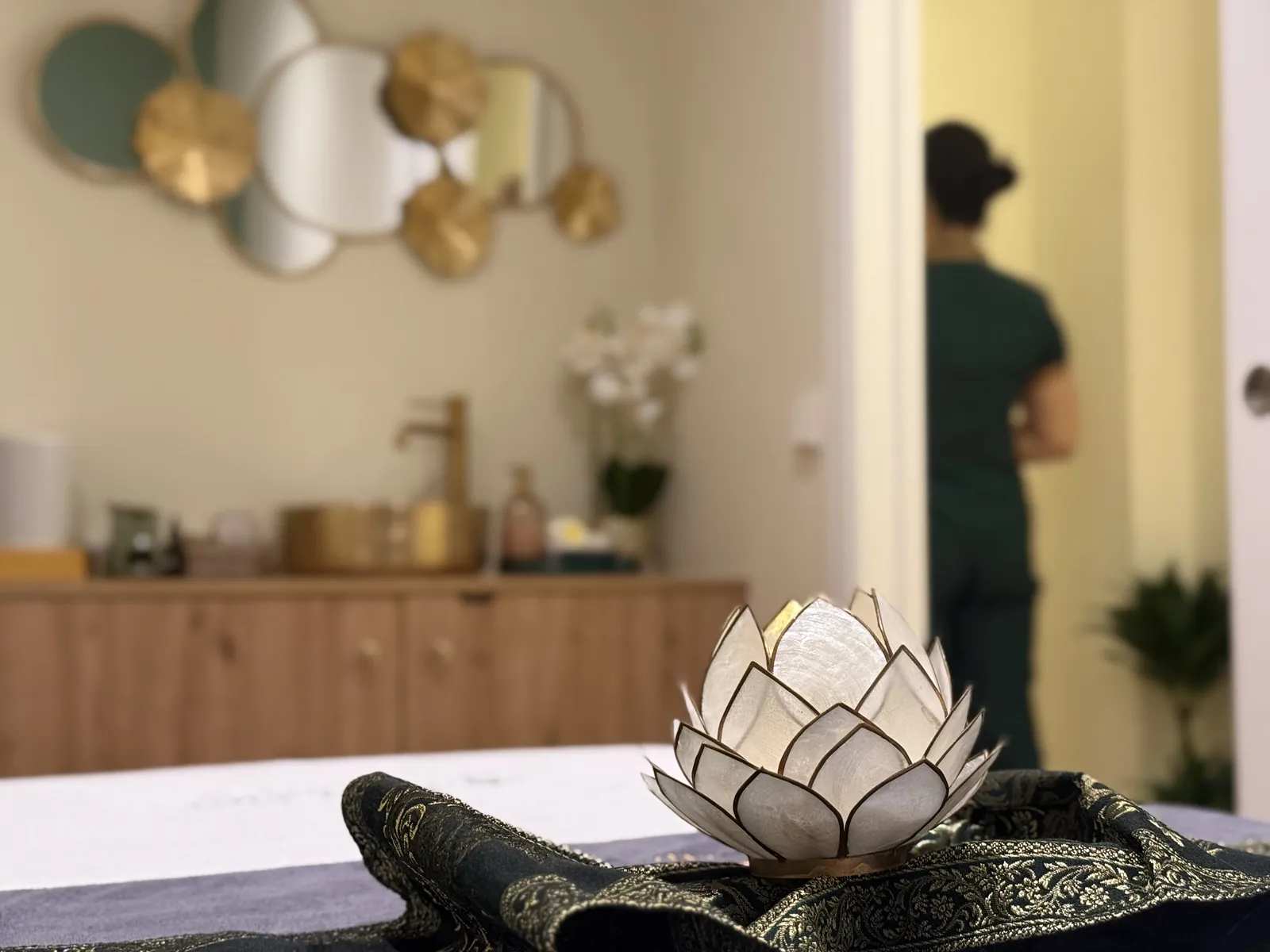 Massage table set up with a lotus flower